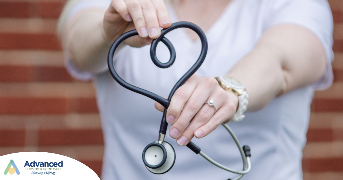 A stethoscope held in a heart represents the self-care that home health workers need to prioritize.