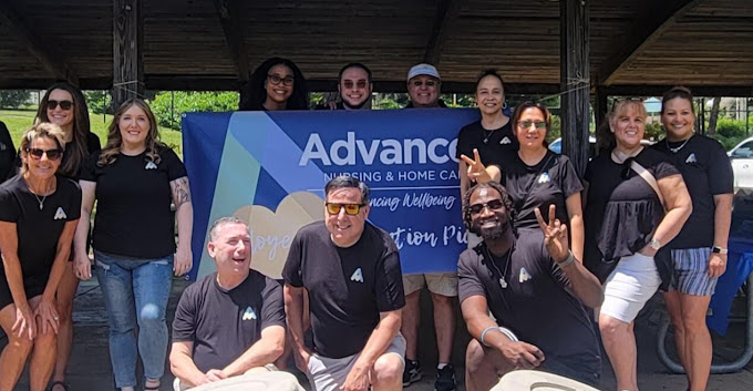 Team members from Advanced Nursing & Home Care smiling together outdoors during the Employee Appreciation Picnic, celebrating teamwork and dedication.