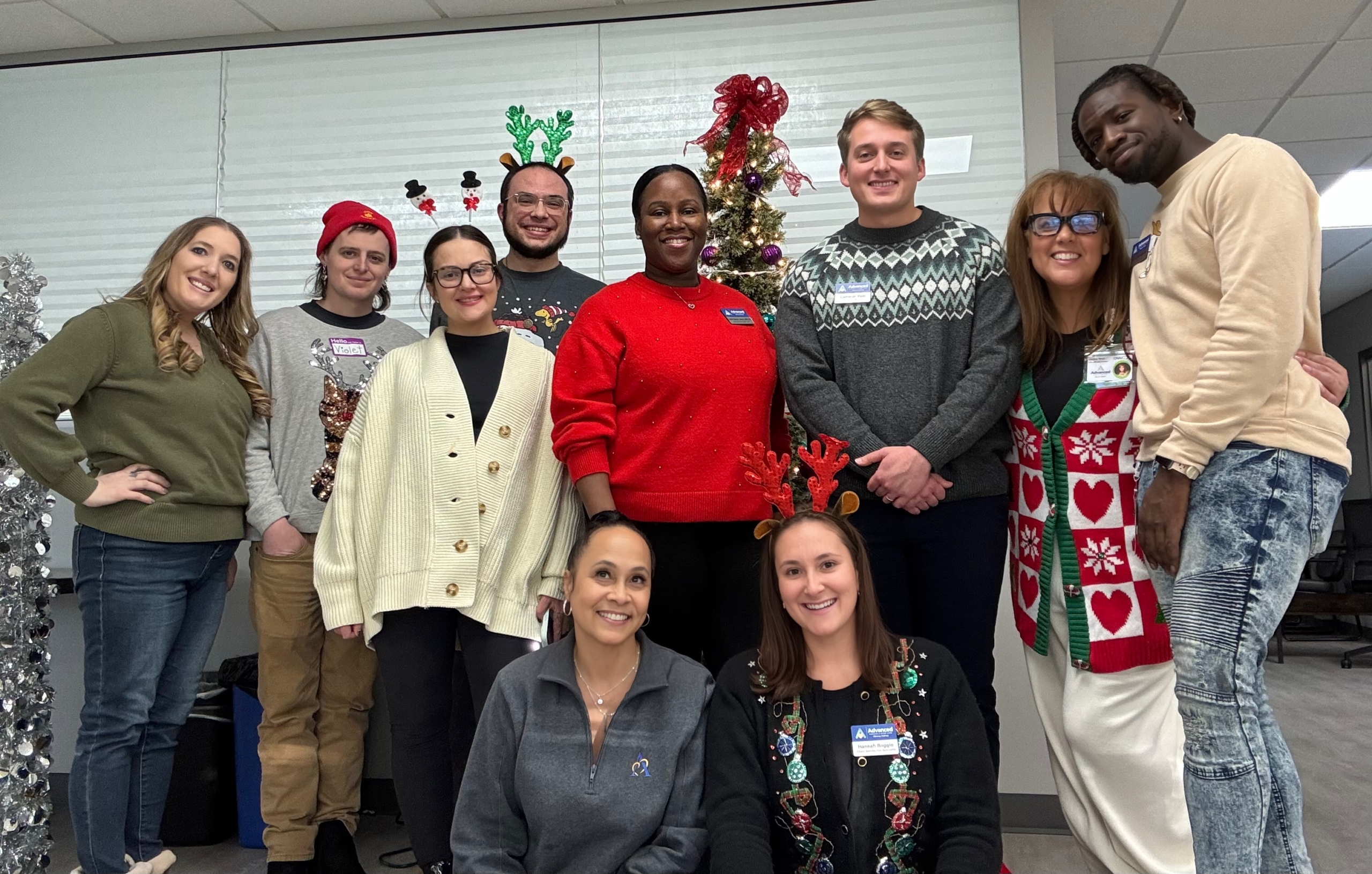 Advanced Nursing & Home Care staff celebrating the holiday season with festive sweaters, decorations, and cheerful team spirit.