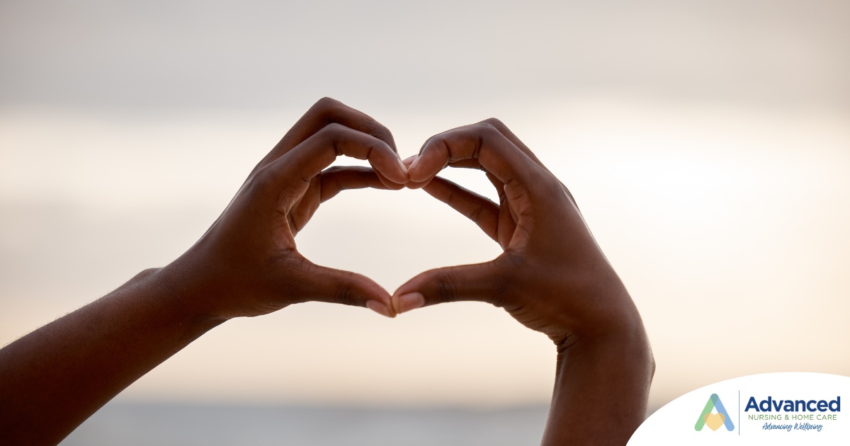2 hands making a heart represent self-care, a vital concept to appreciate as a caregiver.