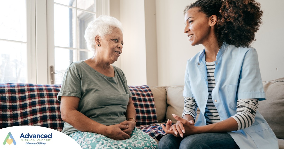 A caregiver sits and spends time with a client, representing how non-medical home care can benefit older loved ones.