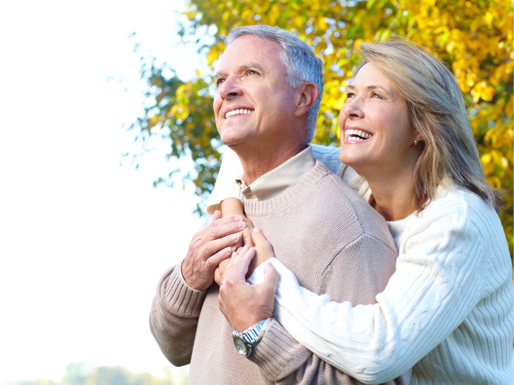 Compassionate Home Care for Seniors – Advanced Nursing & Home Care Smiling senior couple embracing outdoors in autumn, symbolizing joy, support, and quality home care services.