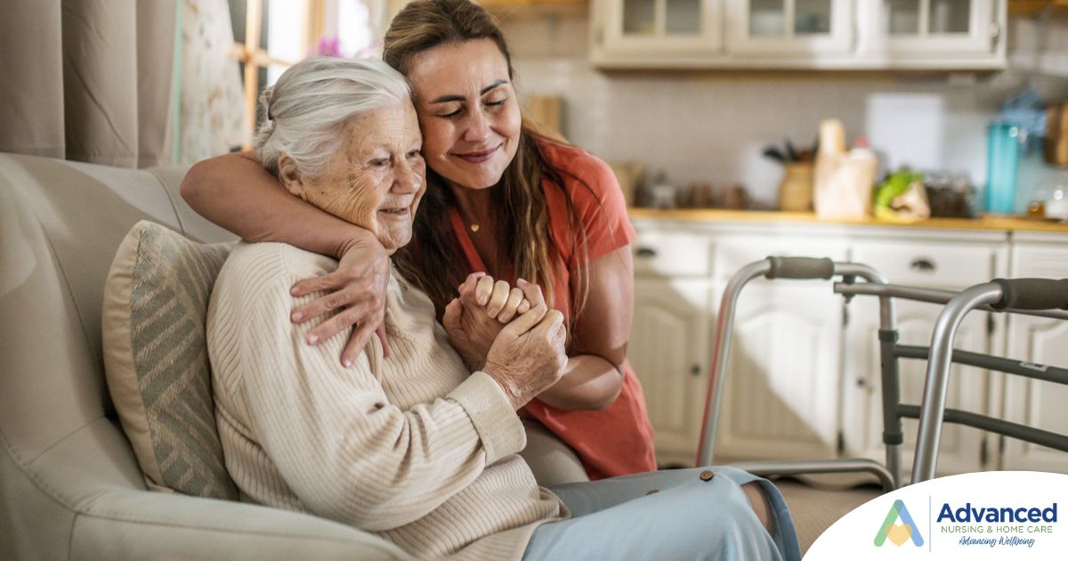Caregiver supporting an elderly woman in the transition to senior home care
