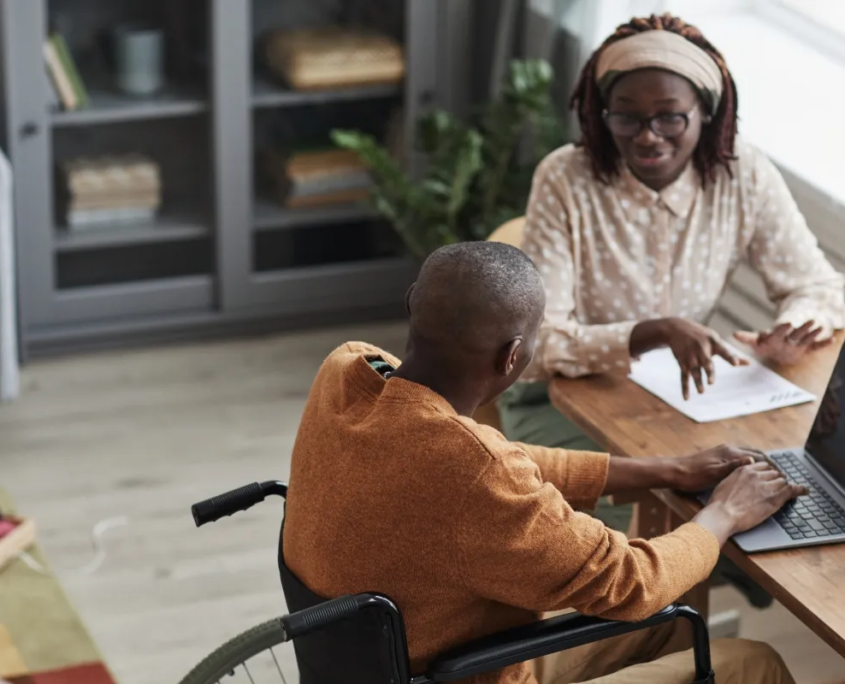 Care coordinator helping senior man with paperwork