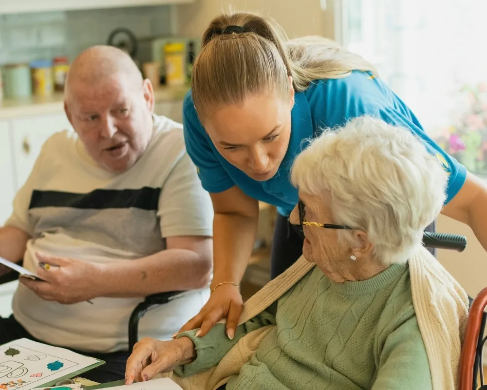 Caregiver arts and crafts activity with seniors