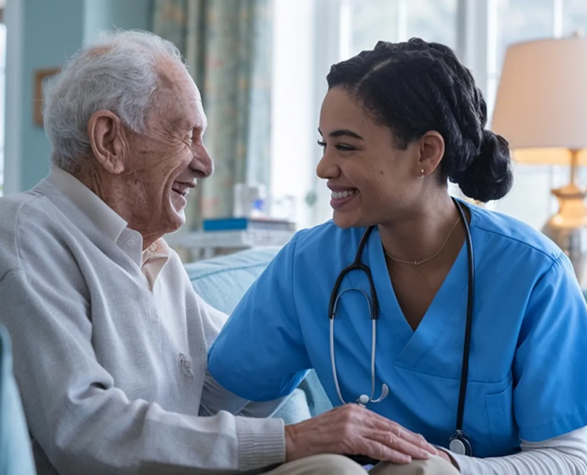 Home care nurse laughing with senior man