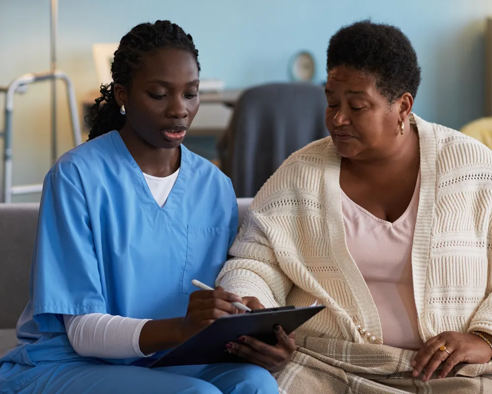 Nurse reviewing care plan with patient