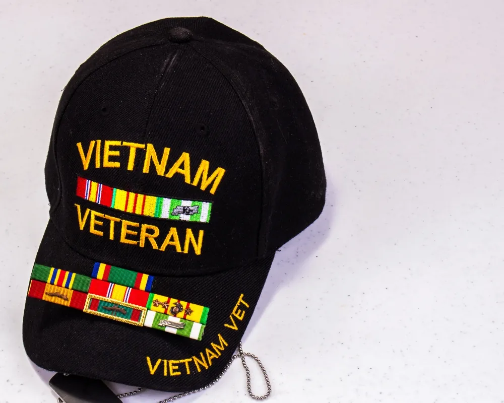 Senior wearing a Vietnam veteran cap