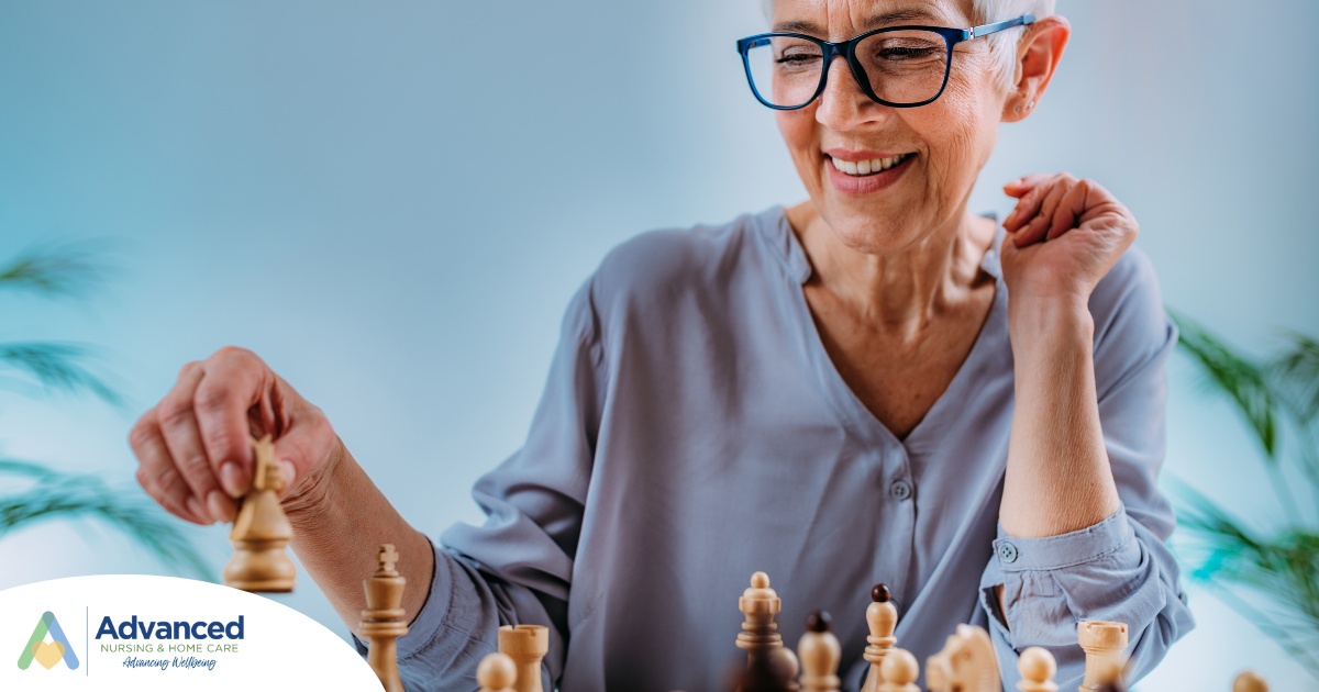 An older woman plays chess, an activity that can help older adults stay sharp.