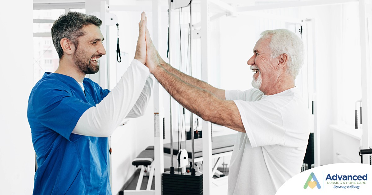A healthcare worker and patient smile and high five representing the satisfaction that can come from a career as a physical therapy assistant.